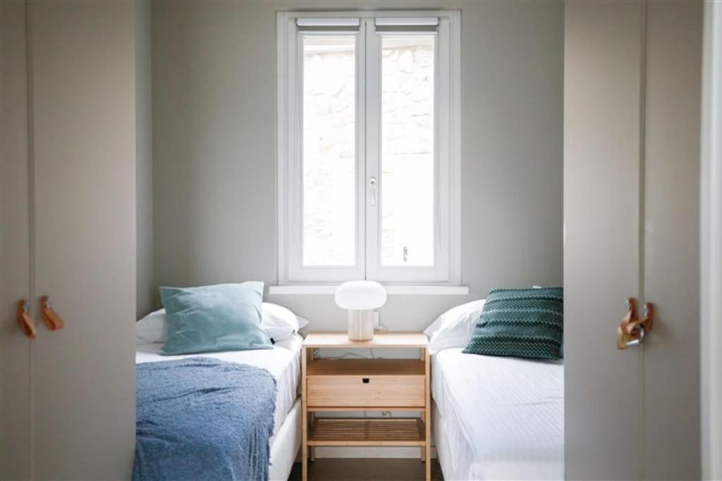 A bed or beds in a room at IseoLakeRental - Trivia Bellavista