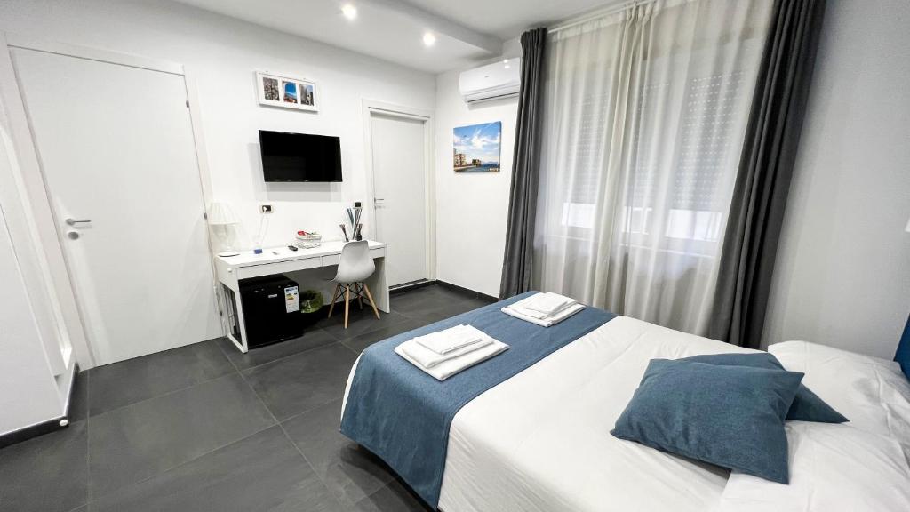 Łóżko lub łóżka w pokoju w obiekcie Soave Rooms
