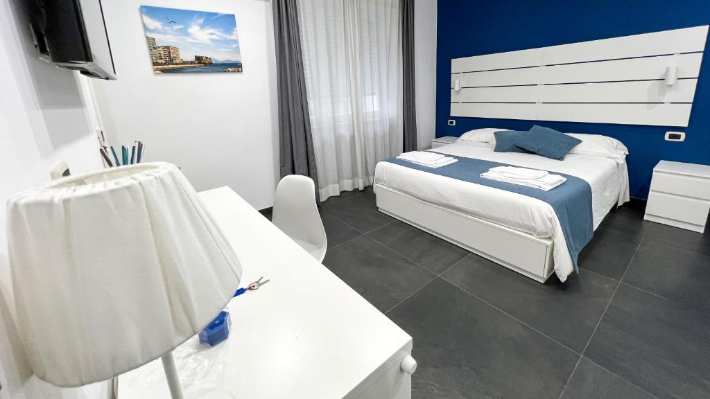 Łóżko lub łóżka w pokoju w obiekcie Soave Rooms