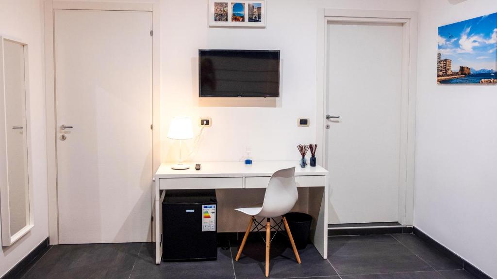 Telewizja i/lub zestaw kina domowego w obiekcie Soave Rooms