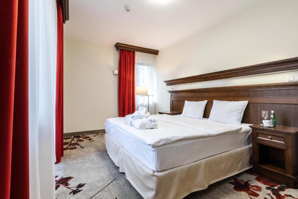 Postel nebo postele na pokoji v ubytování Hotel Crocus