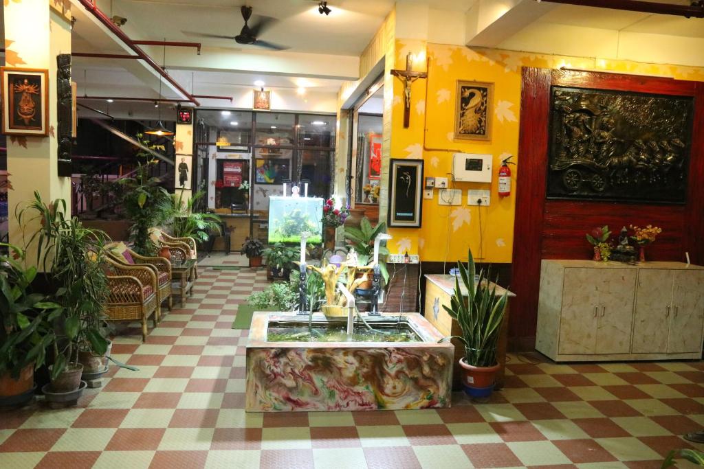 a store with a room filled with lots of plants at The Elite Apartment Hotel in Kolkata