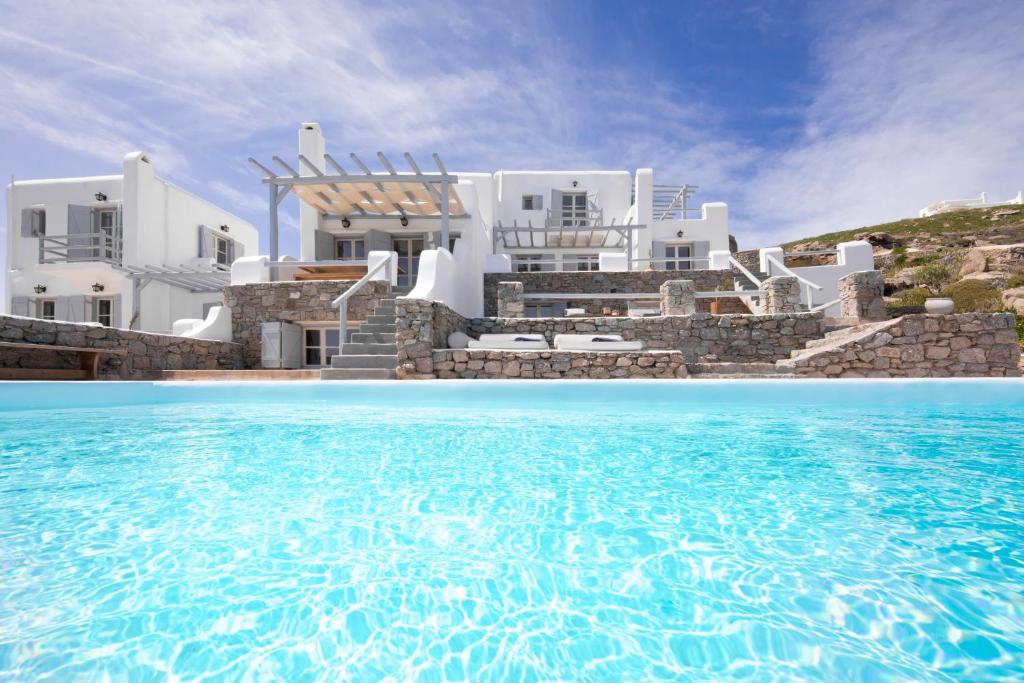 The swimming pool at or close to MYKONOS-ORNOS -VILAS ANGEL ALICE DEMI -POOL HOLIDAYS with VIEW