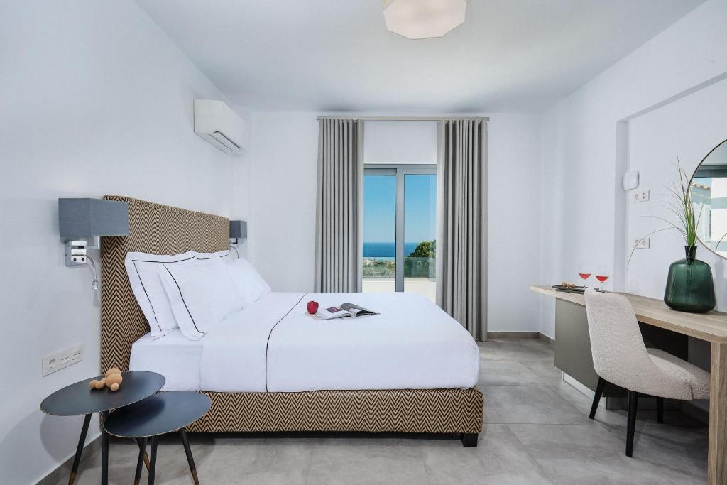 Postel nebo postele na pokoji v ubytování Quattro Suites