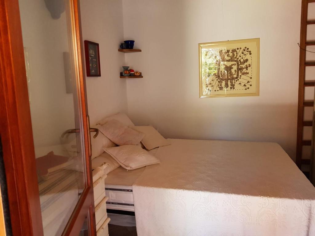 Postel nebo postele na pokoji v ubytování Residenze Coda Cavallo
