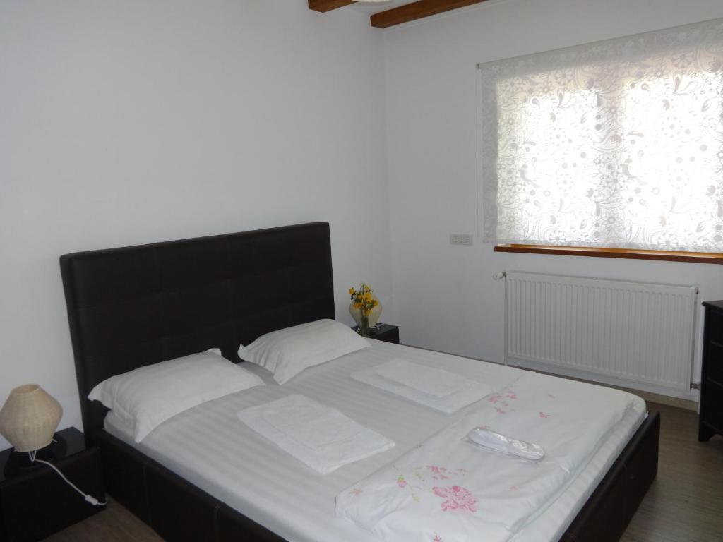 Postel nebo postele na pokoji v ubytování Villa Zorba