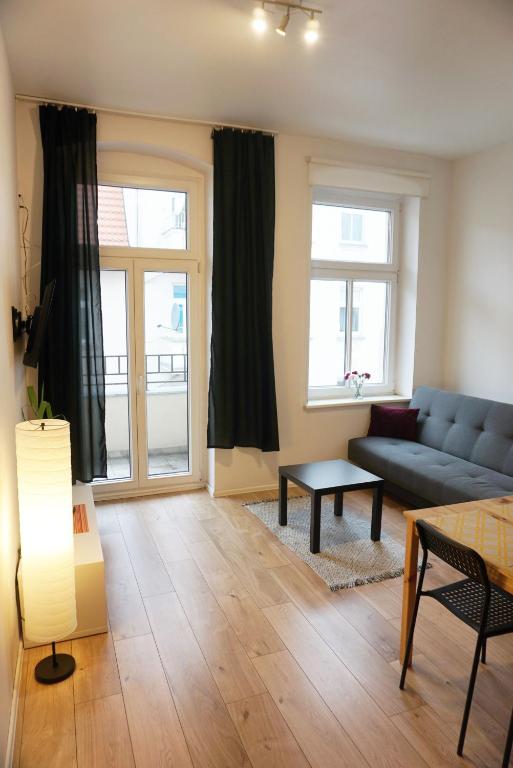 Część wypoczynkowa w obiekcie Cosy Balcony Apartment