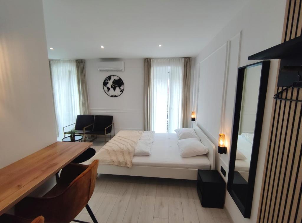 Posteľ alebo postele v izbe v ubytovaní Alegra Apartments Center