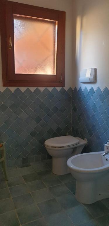Koupelna v ubytování Residenze Coda Cavallo