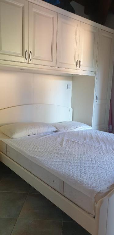 Postel nebo postele na pokoji v ubytování Residenze Coda Cavallo