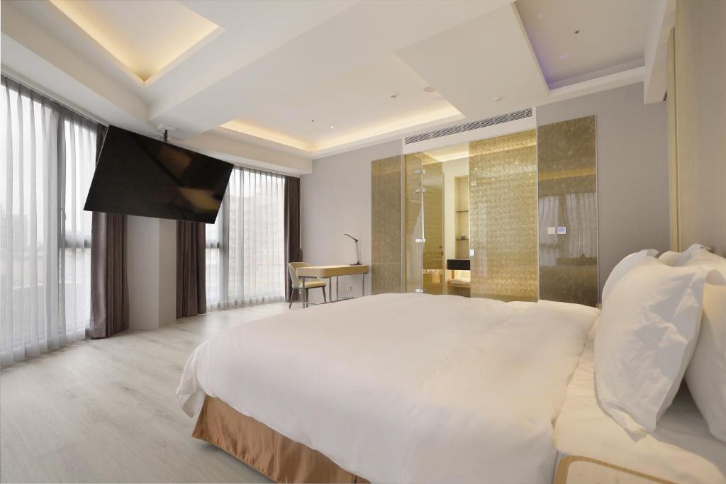 Postel nebo postele na pokoji v ubytování Gamalan Star Hotel