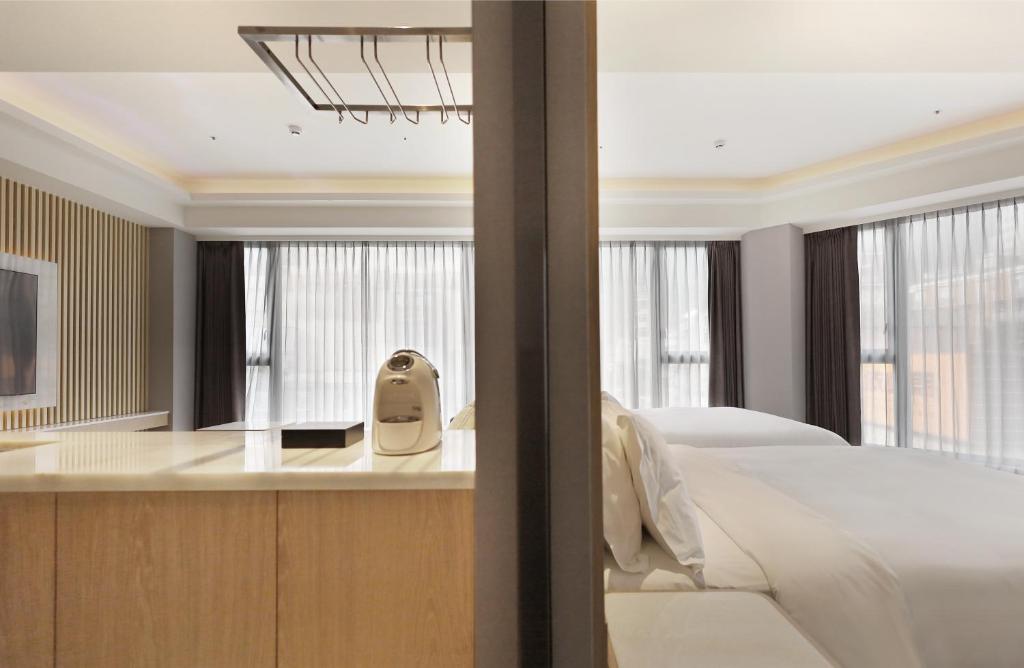 Postel nebo postele na pokoji v ubytování Gamalan Star Hotel