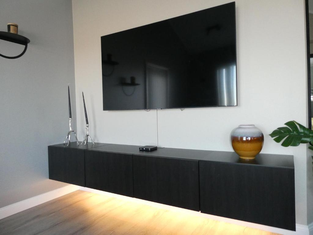 TV a/nebo společenská místnost v ubytování Northberg Apartments