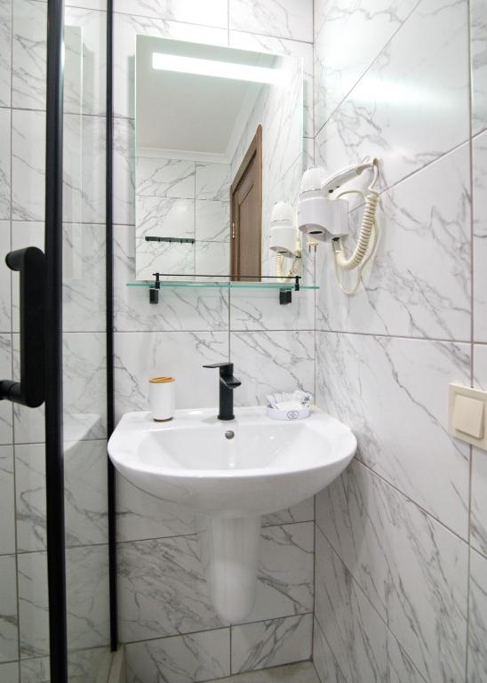Koupelna v ubytování Apart-Hotel Poseidon
