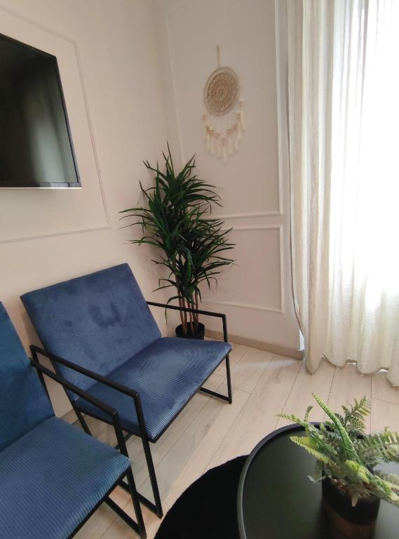 Televízia a/alebo spoločenská miestnosť v ubytovaní Alegra Apartments Center