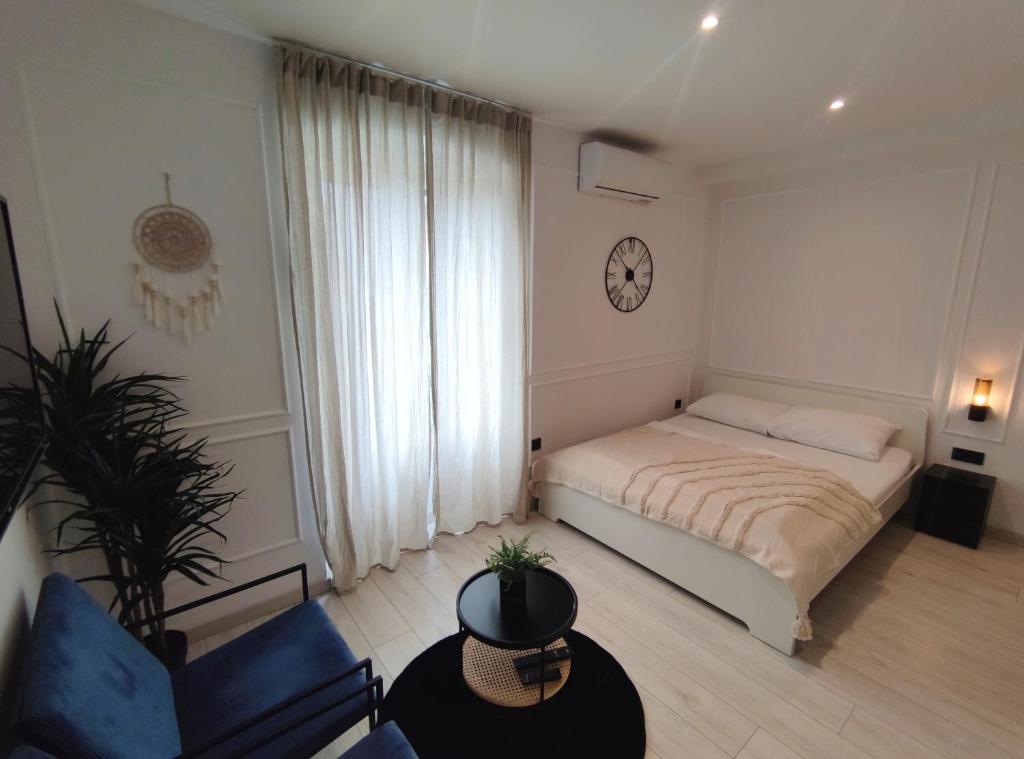 Posteľ alebo postele v izbe v ubytovaní Alegra Apartments Center
