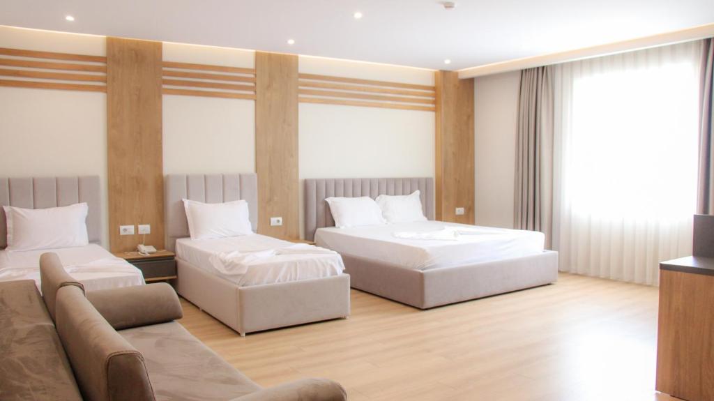 Postel nebo postele na pokoji v ubytování Hotel Colis