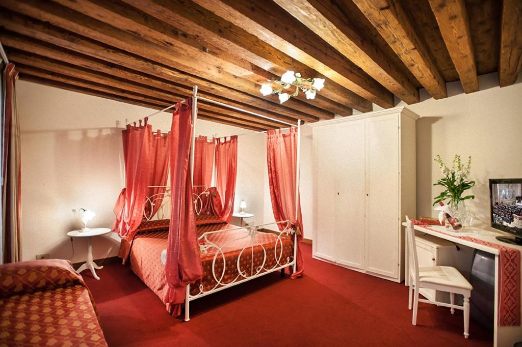 Postel nebo postele na pokoji v ubytování Maison San Marco