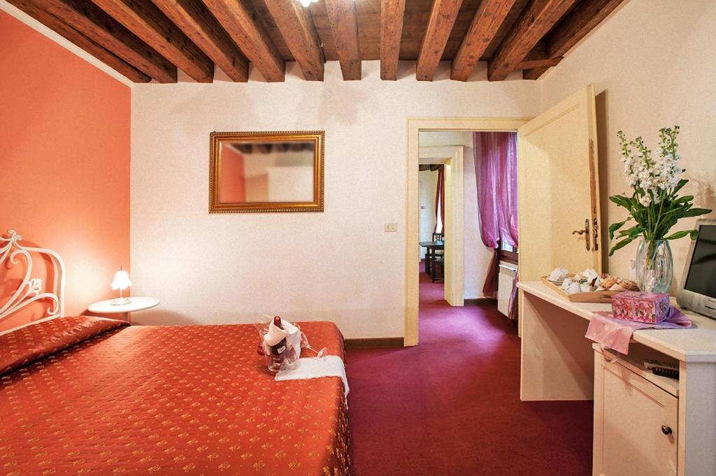Postel nebo postele na pokoji v ubytování Maison San Marco