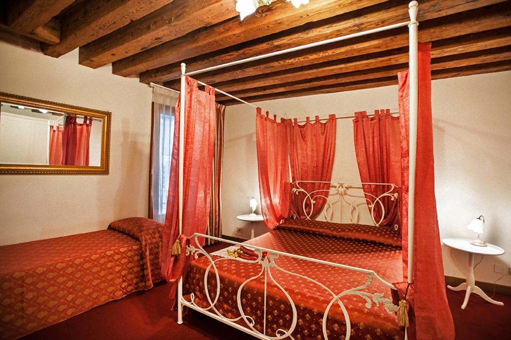 Postel nebo postele na pokoji v ubytování Maison San Marco