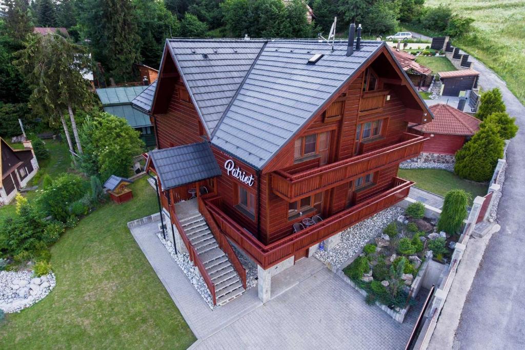 an overhead view of a large wooden house at Villa Patriot - Penzión in Vyšné Ružbachy