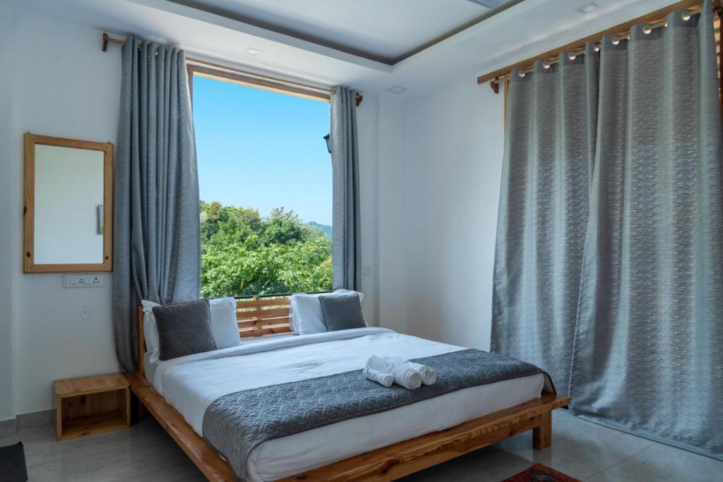 Postel nebo postele na pokoji v ubytování ilaka Homes