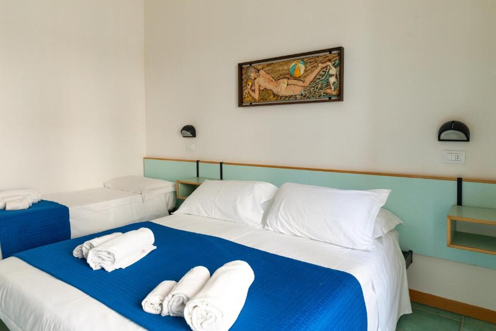 Postel nebo postele na pokoji v ubytování Hotel Plaza con piscina