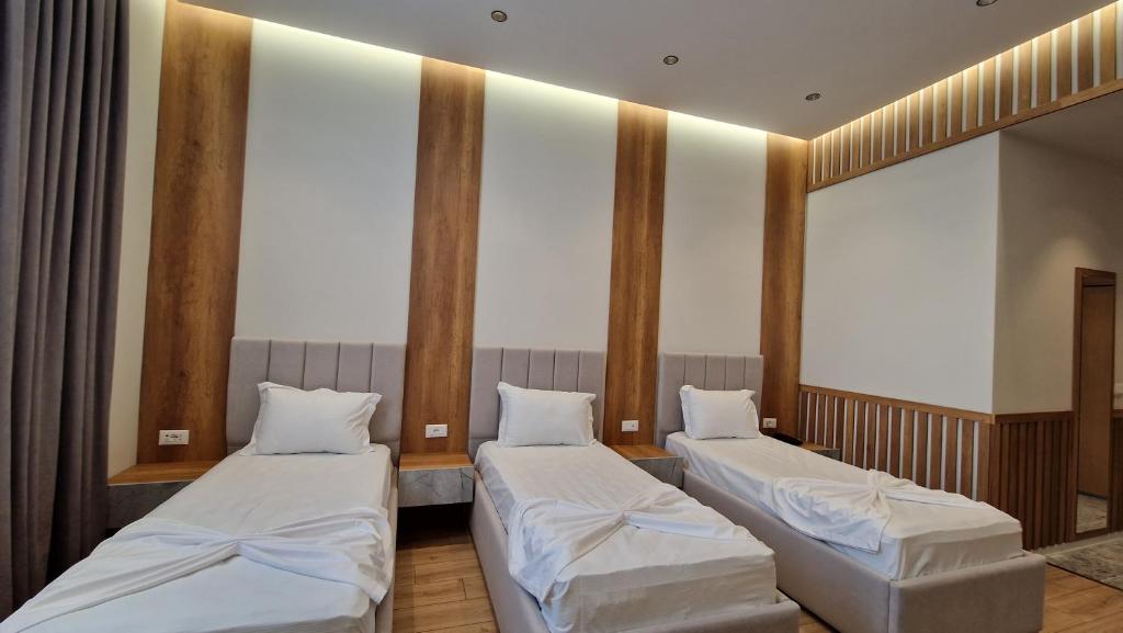 Postel nebo postele na pokoji v ubytování Hotel Colis