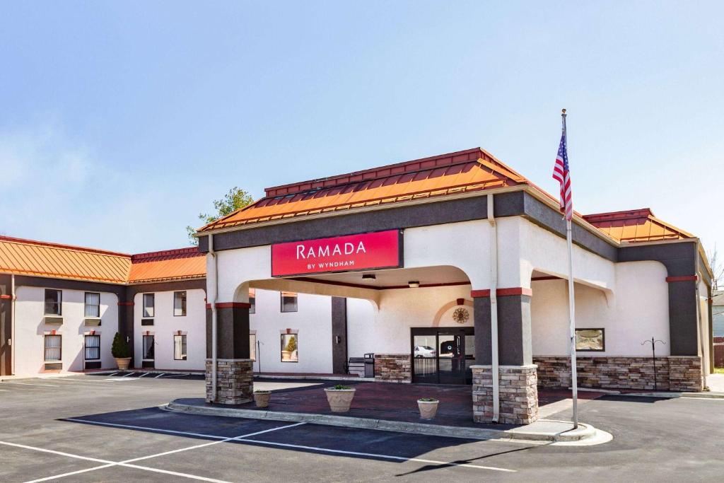 a building with a sign that reads ramada at Ramada by Wyndham Hendersonville in Hendersonville