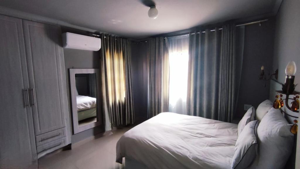 Кровать или кровати в номере Labas Travellers Guesthouse
