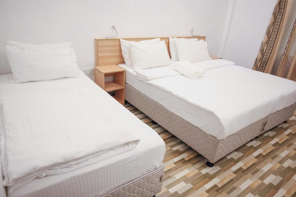 Postel nebo postele na pokoji v ubytování Golhaaviewinn