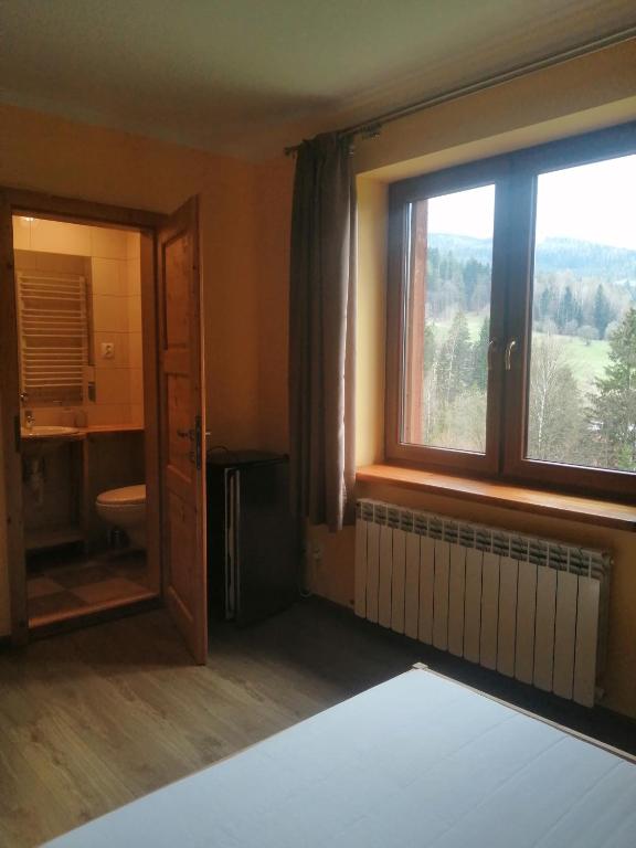 Postel nebo postele na pokoji v ubytování Noclegi Na Smaguli