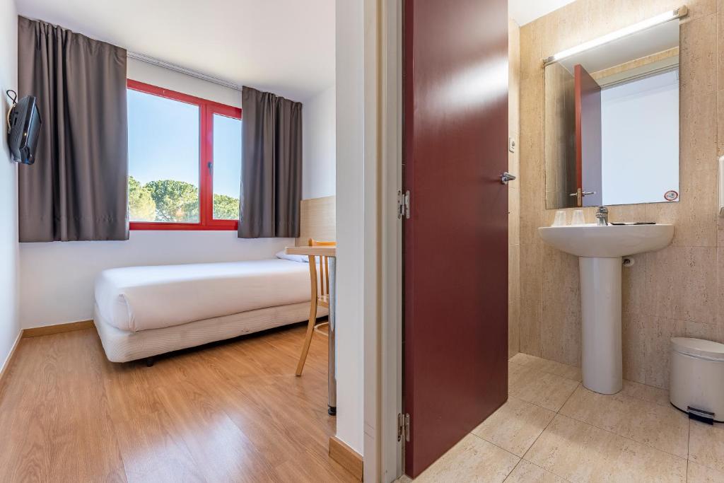 Postel nebo postele na pokoji v ubytování Hotel Basic