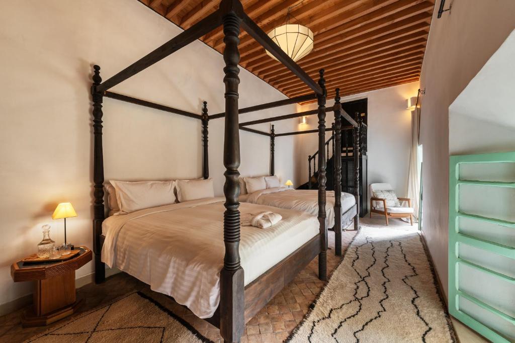 Postel nebo postele na pokoji v ubytování Riad Kitula