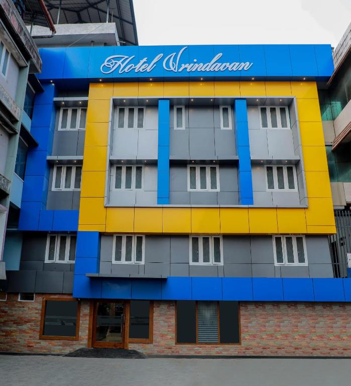 a building that is painted in the colors at Hotel Vrindavan in Wayanad