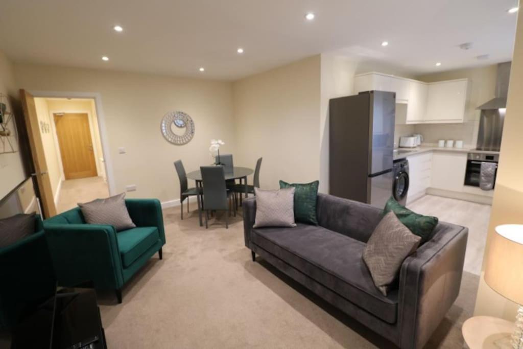 a living room with a couch and a dining room at The Loft - IH21ALL - APT 9 in Thornaby on Tees