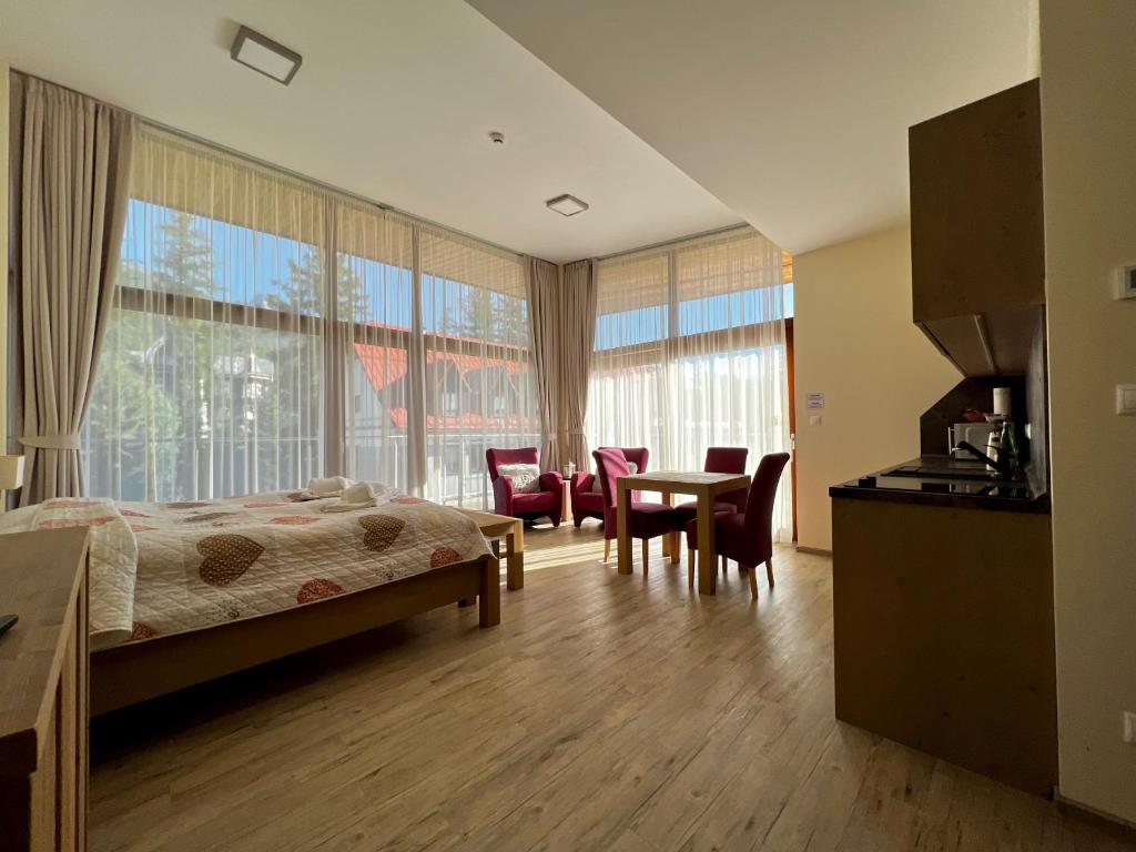 A bed or beds in a room at Apartmány Tatry