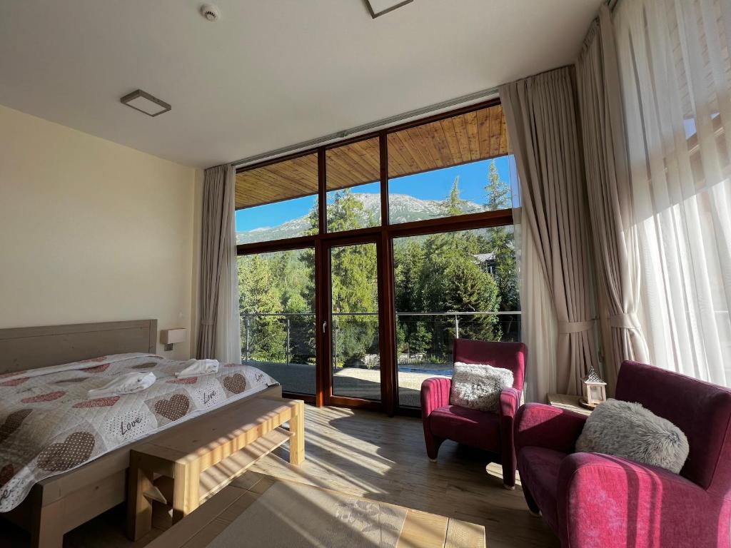 A bed or beds in a room at Apartmány Tatry