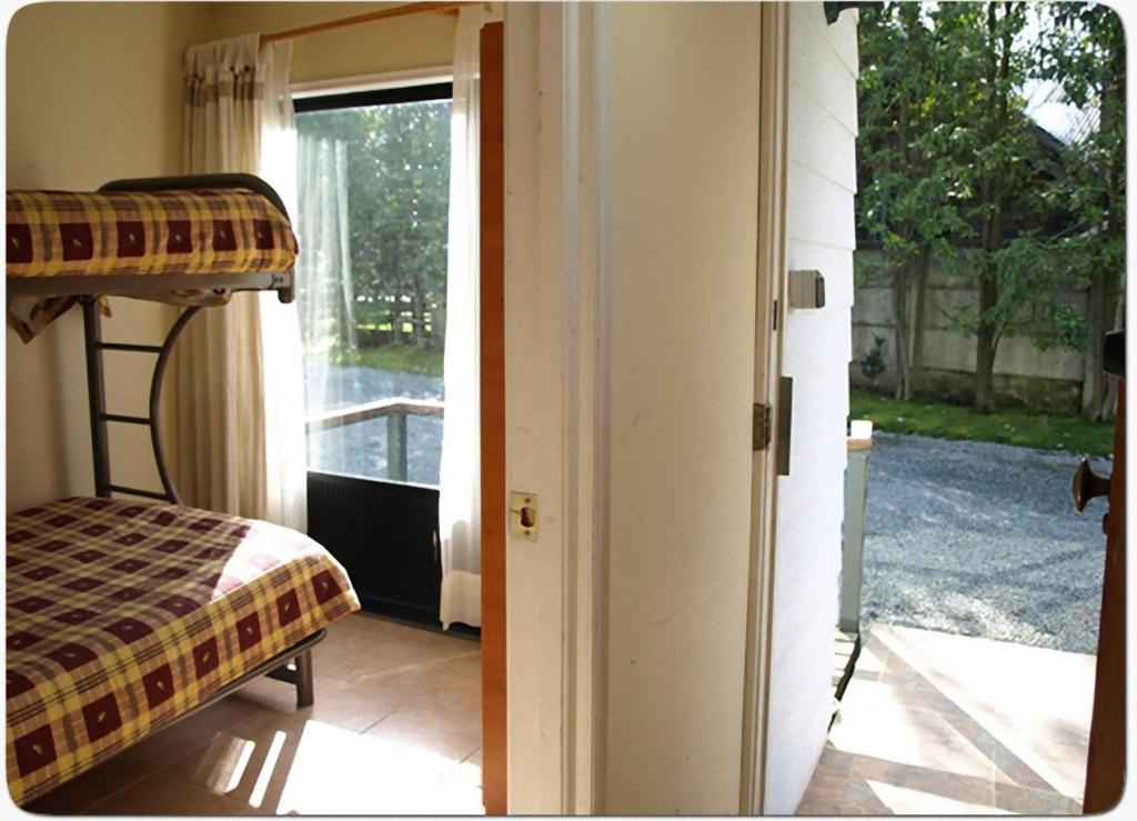 Postel nebo postele na pokoji v ubytování Cabañas Los Pinis