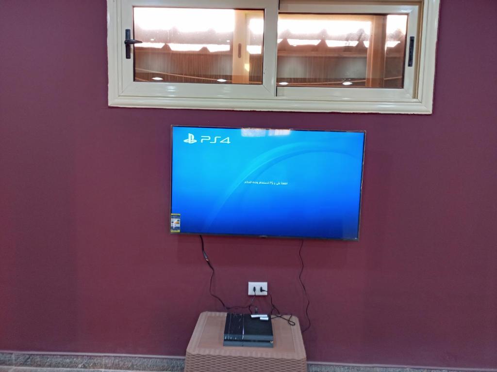 A television and/or entertainment centre at La Sirena Hotel & Resort - Families only