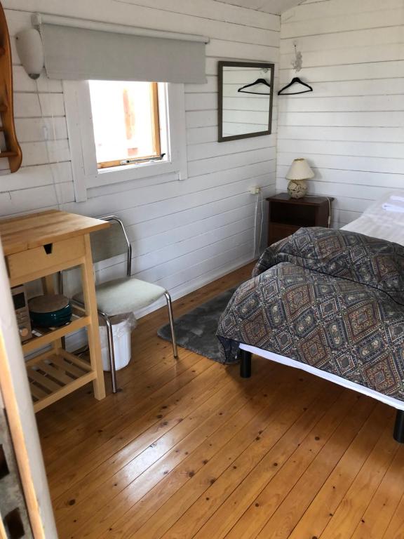 Rúm í herbergi á Seljaland ferðaþjónusta