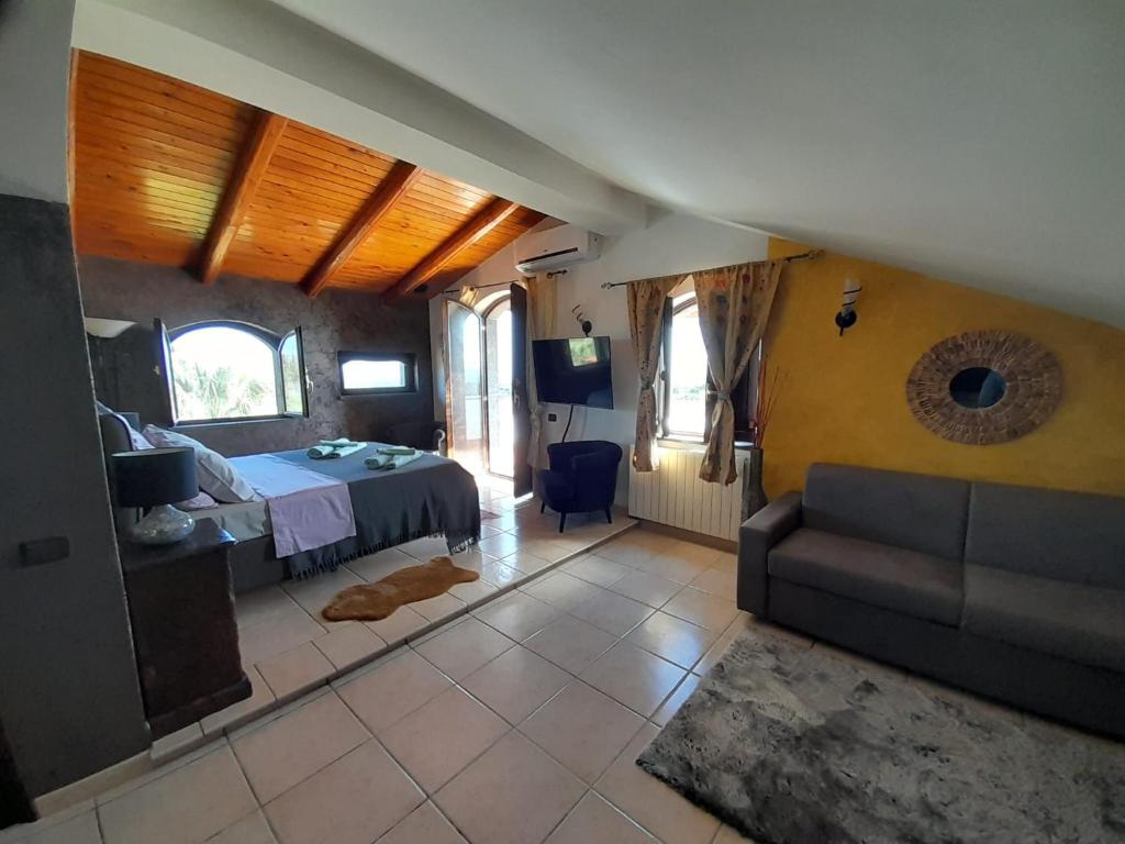 Postel nebo postele na pokoji v ubytování Luxury b&b Le Rocce
