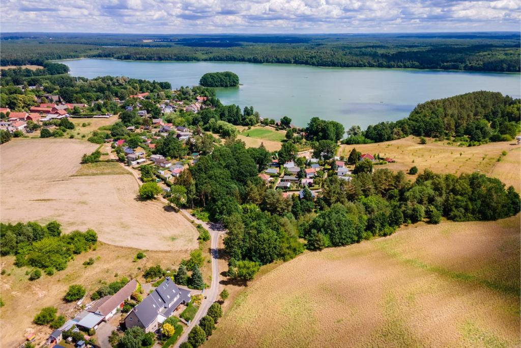 an aerial view of a town with a lake at Ferienhaus Mila in Schwarz