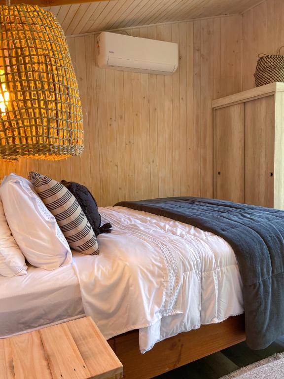 Postel nebo postele na pokoji v ubytování Cabañas Los Huemules