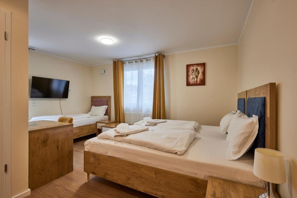 Postel nebo postele na pokoji v ubytování Hotel Isha
