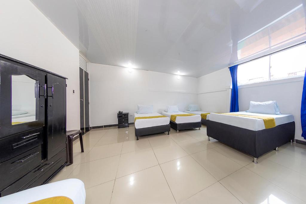 Postel nebo postele na pokoji v ubytování Hotel Confort Obelisk