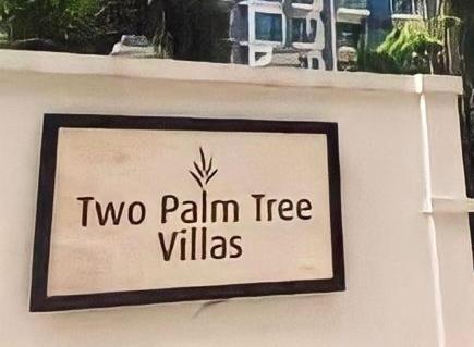 a sign that says two palm tree villas on a wall at Condo in Newport City Pasay near NAIA T3 AIRPORT MANILA in Manila