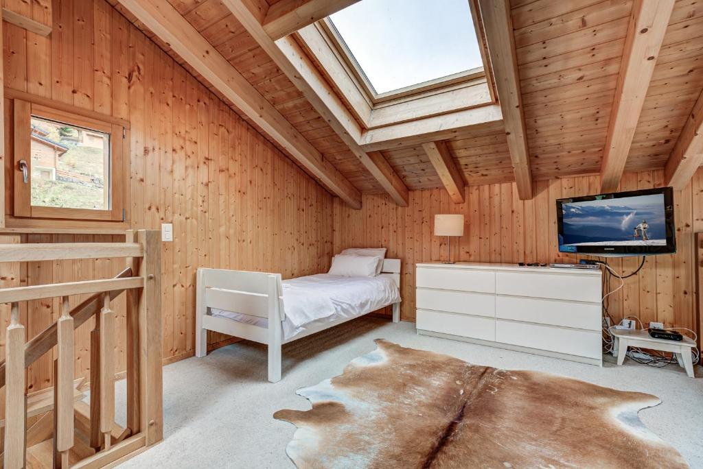 Cama o camas de una habitación en Chalet le Fauconnier