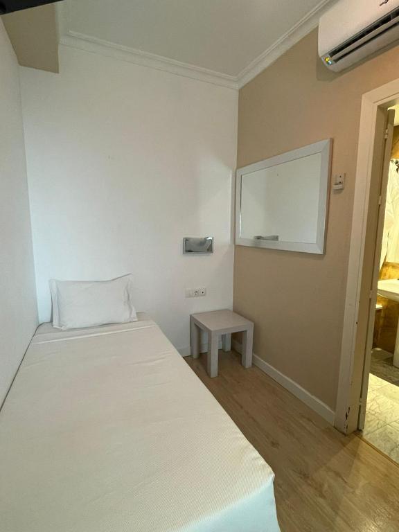 Postel nebo postele na pokoji v ubytování Hotel Trafalgar