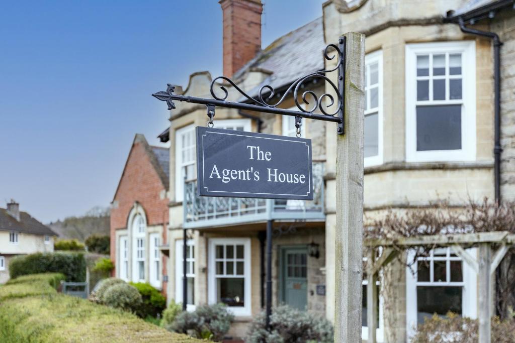 a sign that reads the agents house in front of a house at The Agents House, Bed & Breakfast in Hereford